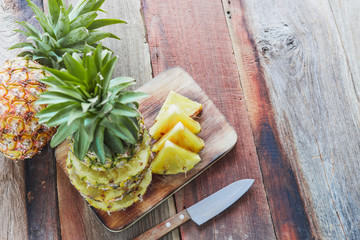 pineapple on the wood texture background
