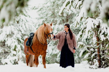 Fototapeta na wymiar Beautiful young model with the horse
