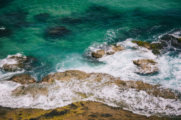 White Waves Splashing Against The Sea Rocks - 199910184