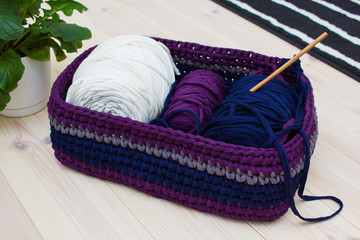 Coils of ribbon yarn in the handmade basket