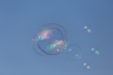 Nice bubbles flying on the blue sky