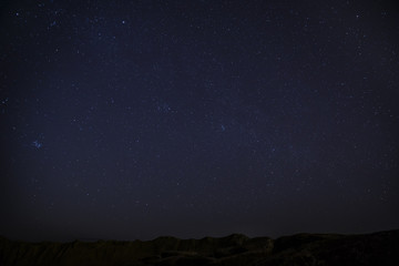 Starry sky above the stone desert