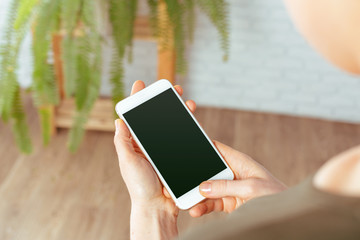 close up of woman texting on smartphone