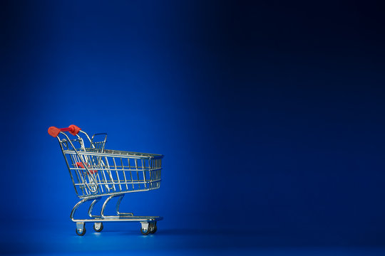 Shopping Cart Trolley on a Dark Blue Background