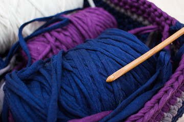 Close up coils of ribbon yarn in the handmade basket