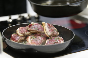 Fry meat in a frying pan.Fry the duck. Preparation of meat dishes.