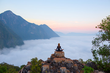 Serenity and yoga practicing,meditation at mountain range