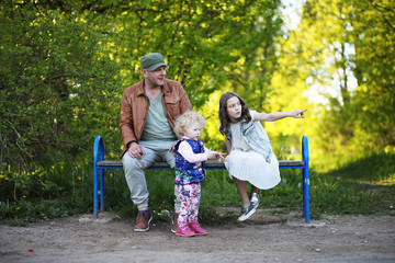 Fototapeta na wymiar Girl with father in the park in the spring