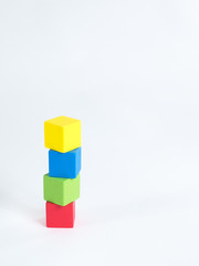 Fototapeta premium Colorful wooden building blocks isolated on white background