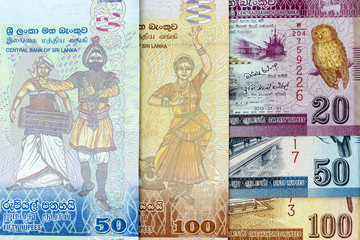 Currency banknotes spread across frame sri lankan rupee in various denomination
