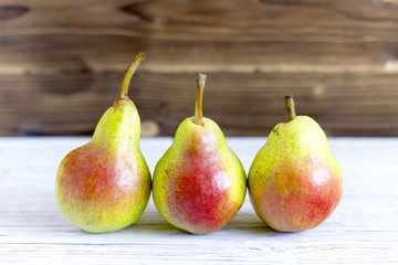 fresh pears on wooden background