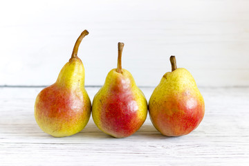 fresh pears on wooden background