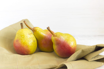 fresh pears on wooden background