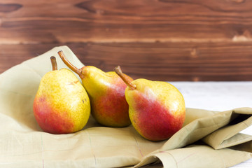 fresh pears on wooden background