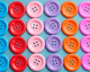 Rows of colorful buttons on a blue background