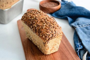 Fototapeta na wymiar Slices of finest organic bread decorated with natural cereals.