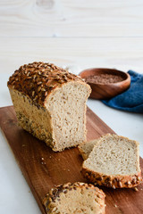 Slices of finest organic bread decorated with natural cereals.