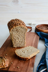 Slices of finest organic bread decorated with natural cereals.