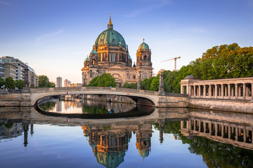 Fototapeta na wymiar Berlin Cathedral reflected in Spree River at dawn, Germany