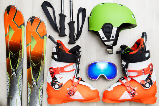 Photo of skier objects on wooden background.