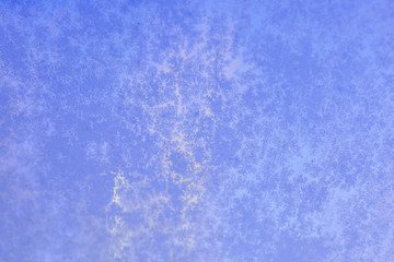 purple frozen car window textured with ice pattern