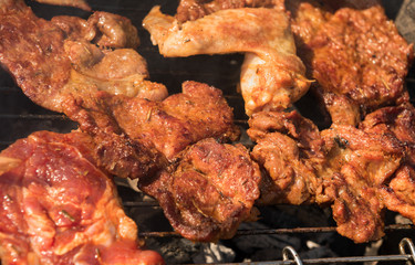 
meat on a hot grill with smoke