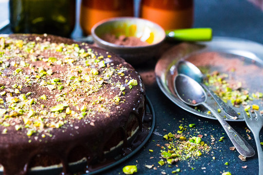 Chocolate Cake with Pistachios Nuts on Dark Background, Horizontal View