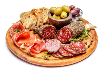 Dried organic salami sausage or spanish chorizo on wooden cutting board