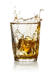 Splash in a transparent glass of whiskey