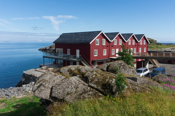 Fototapeta na wymiar Traditional Norwegian red houses on the sea, Lofoten, Norway
