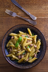 Tuna, basil and caper penne. Pasta with tuna fish. View from above, top studio shot