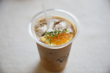 Iced Coffee latte with orange mix in close up