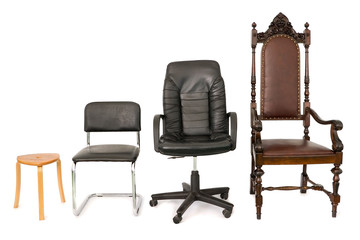 Four chairs on white background arranged by size representing development, career, growth.