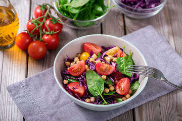 Spinach salad with chickpeas, red cabbage and veggies, healthy food, vegetarian and vegan snack, clean eating, diet, detox