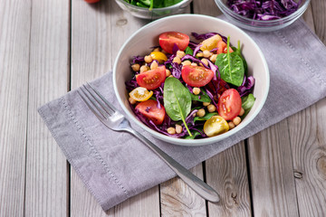 Chickpeas salad with spinach and red cabbage, healthy food, vegetarian and vegan snack, clean eating, diet, detox