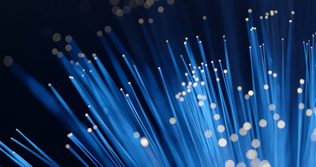 Optical fiber light over black background