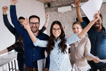 Portrait of successful business team posing in office