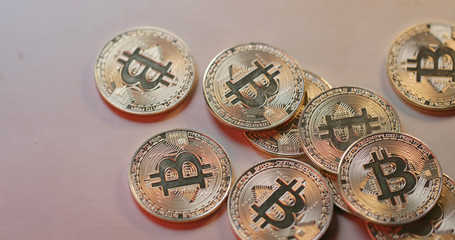 Heap of bitcoin on table