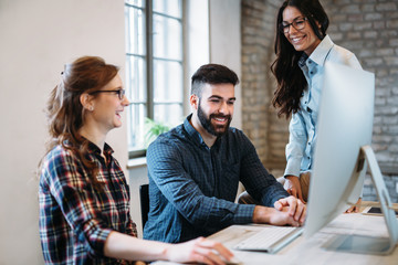 Young architects working on project in office