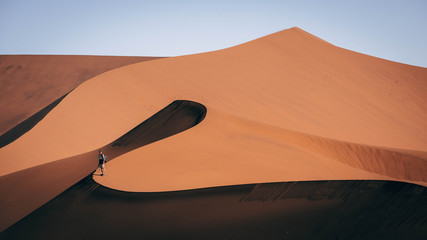 Hiker on sand dune