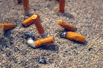 cigarette butts in the sand