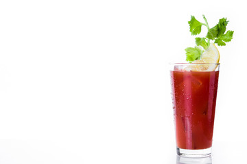 Bloody Mary cocktail in glass on white background. Copyspace

