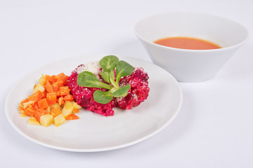 Risotto with red beet on a white
