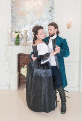 Beautiful couple woman and man in medieval clothes