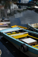 Fototapeta na wymiar photograph of wooden fishing boats parked together on urca beach in the city of rio de janeiro