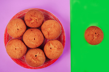 cupcakes scattered over a multicolored background, abstract background concept