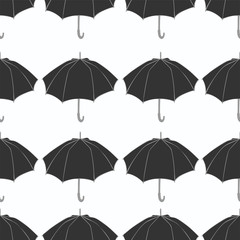 Seamless pattern with doodle umbrellas. For fabric, textile, wallpaper, wrapping paper. Vector Illustration. Hand drawn sketch. Dark gray elements on white background.