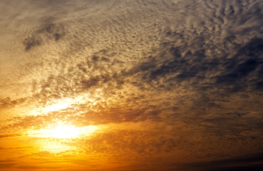 Fototapeta na wymiar Beautiful fiery sunset sky. Cloudy abstract background.