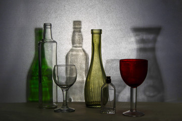 Glassware. Glasses and colored jugs for beverages