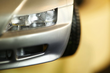 Fototapeta na wymiar Miniature car model intentionally focus super macro at headlight part.